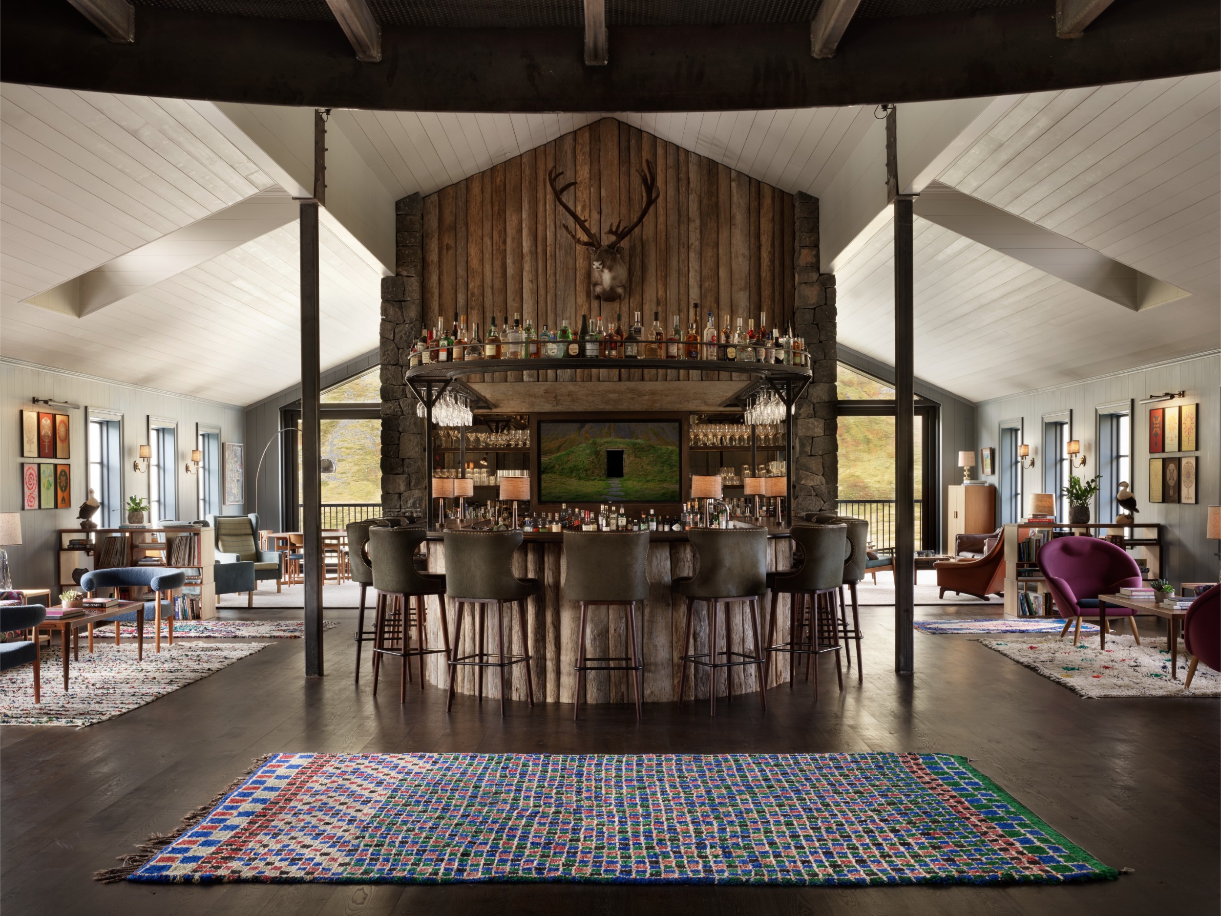 A bar in the middle of a large common area in Deplar Farm Lodge.